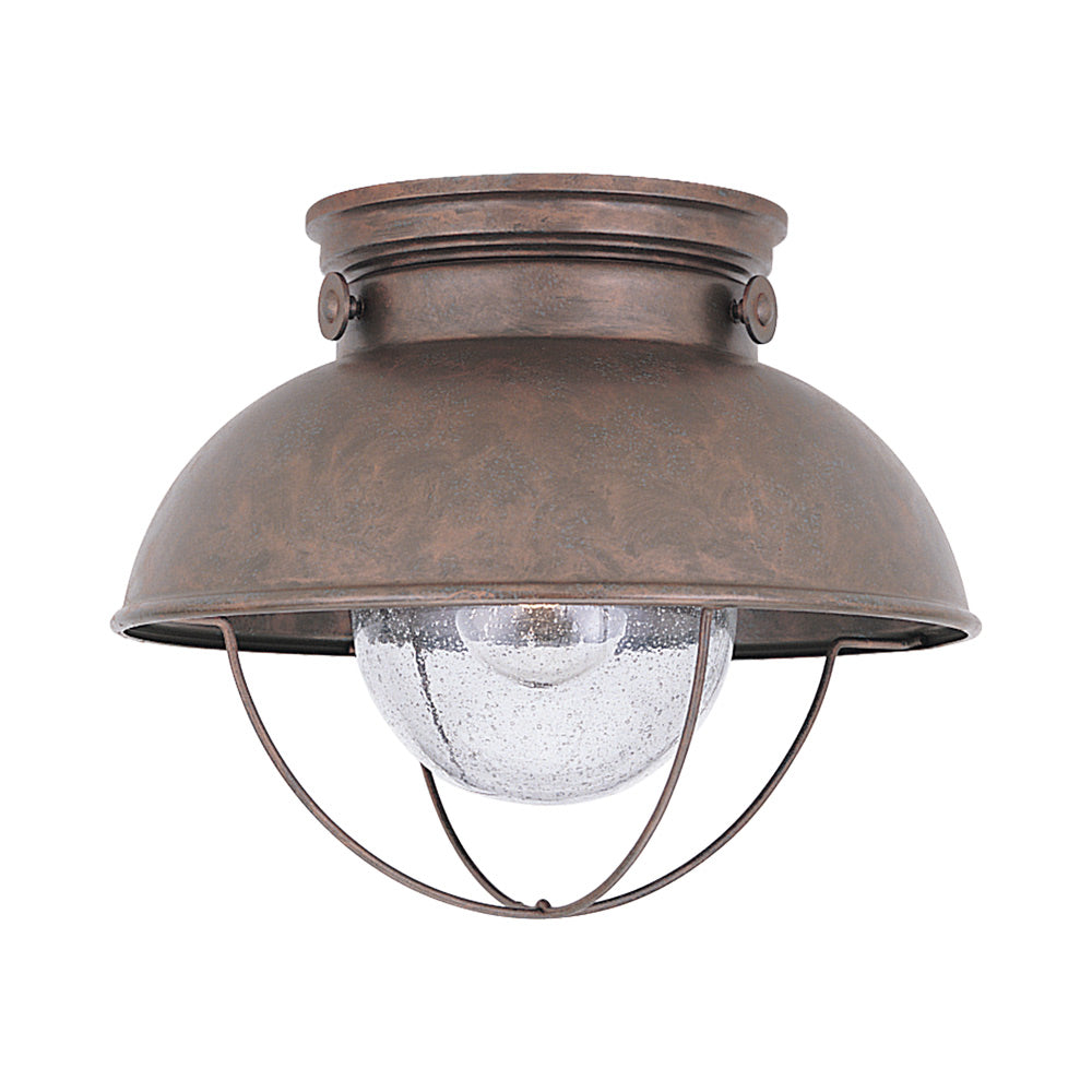Sebring Outdoor Flush Mount Ceiling Light in Weathered Copper.
