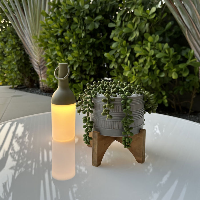 ELO Nomad Portable Outdoor LED Table Lamp in Outdoor area.