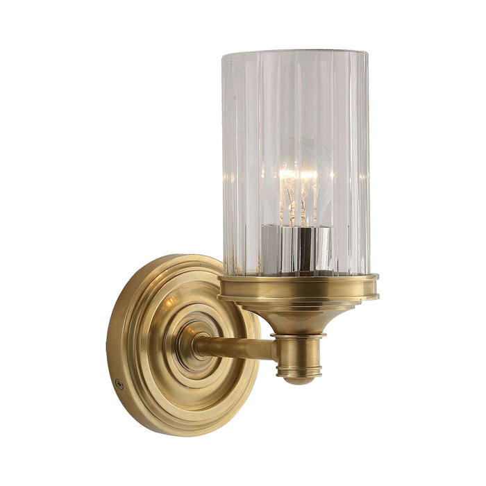 Ava Wall Light in Hand-Rubbed Antique Brass.