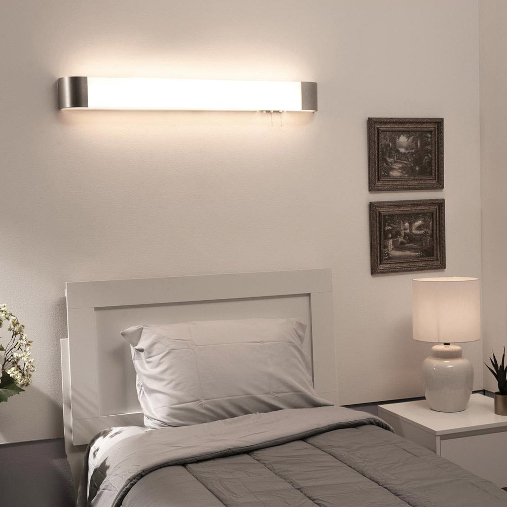 Allen LED Overbed Wall Light in bedroom.