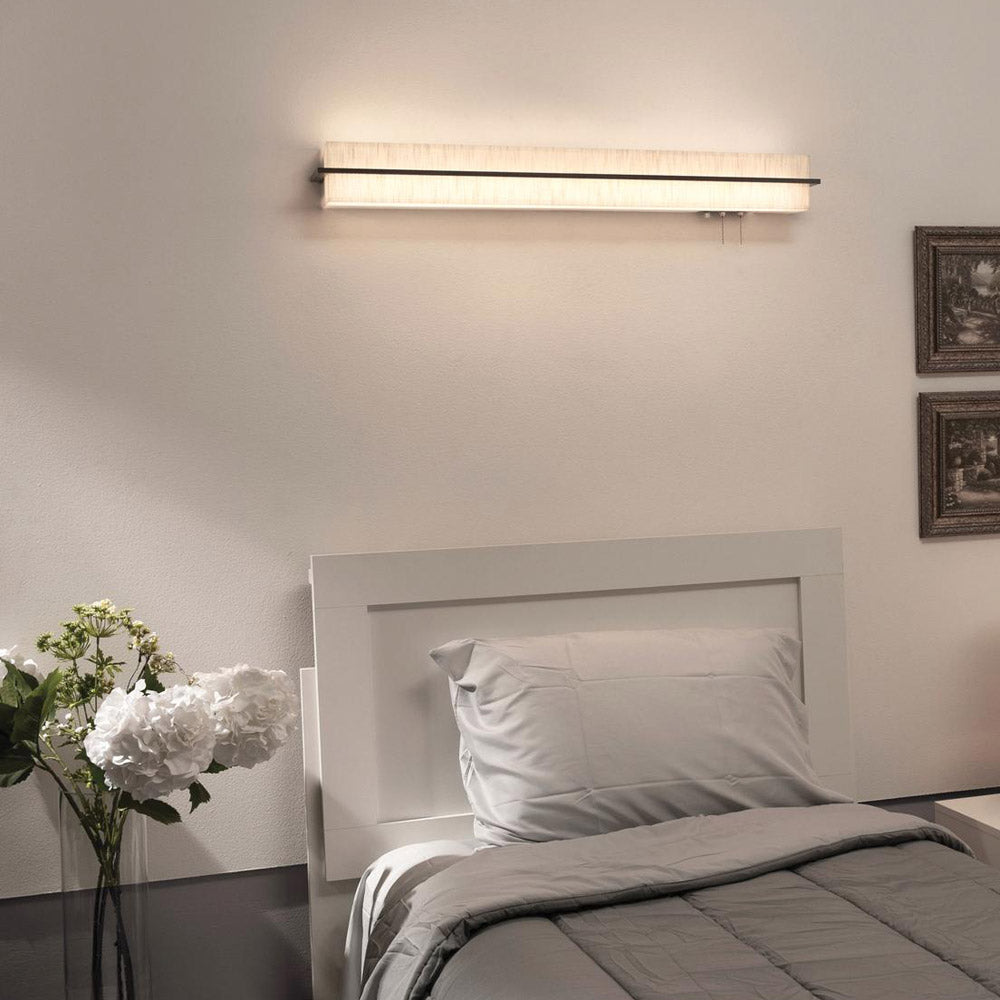 Apex LED Overbed Wall Light in bedroom.