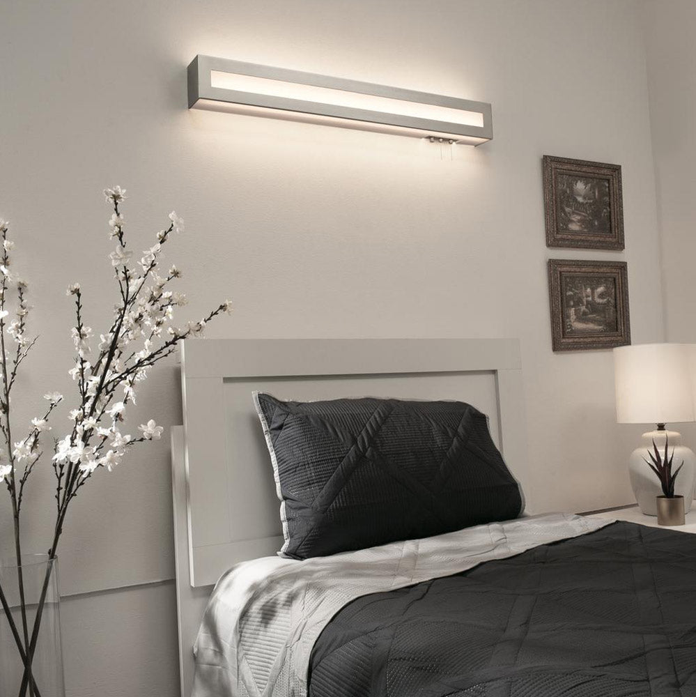 Hayes LED Overbed Wall Light in bedroom.