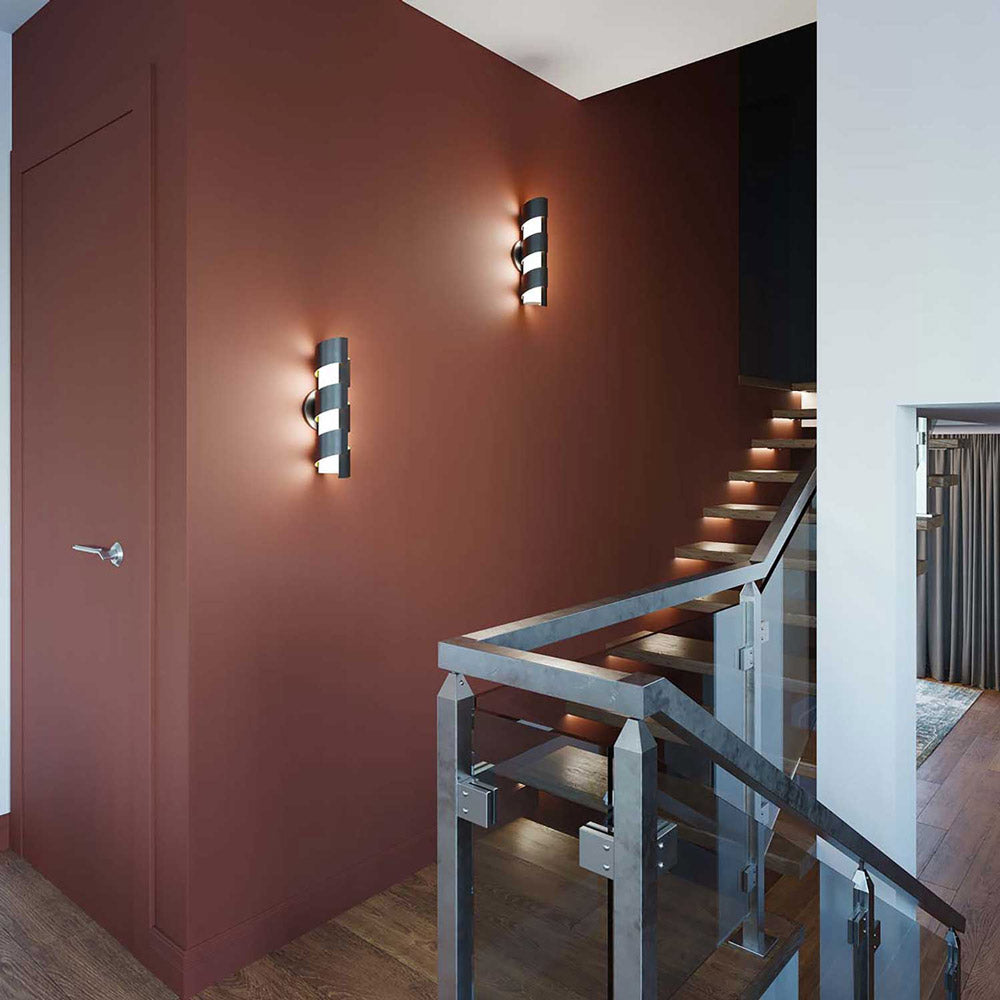 Louie LED Wall Light in stairway.