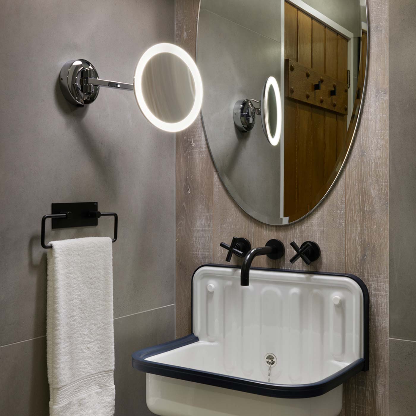 Mascali Round LED Magnifying Mirror in bathroom.