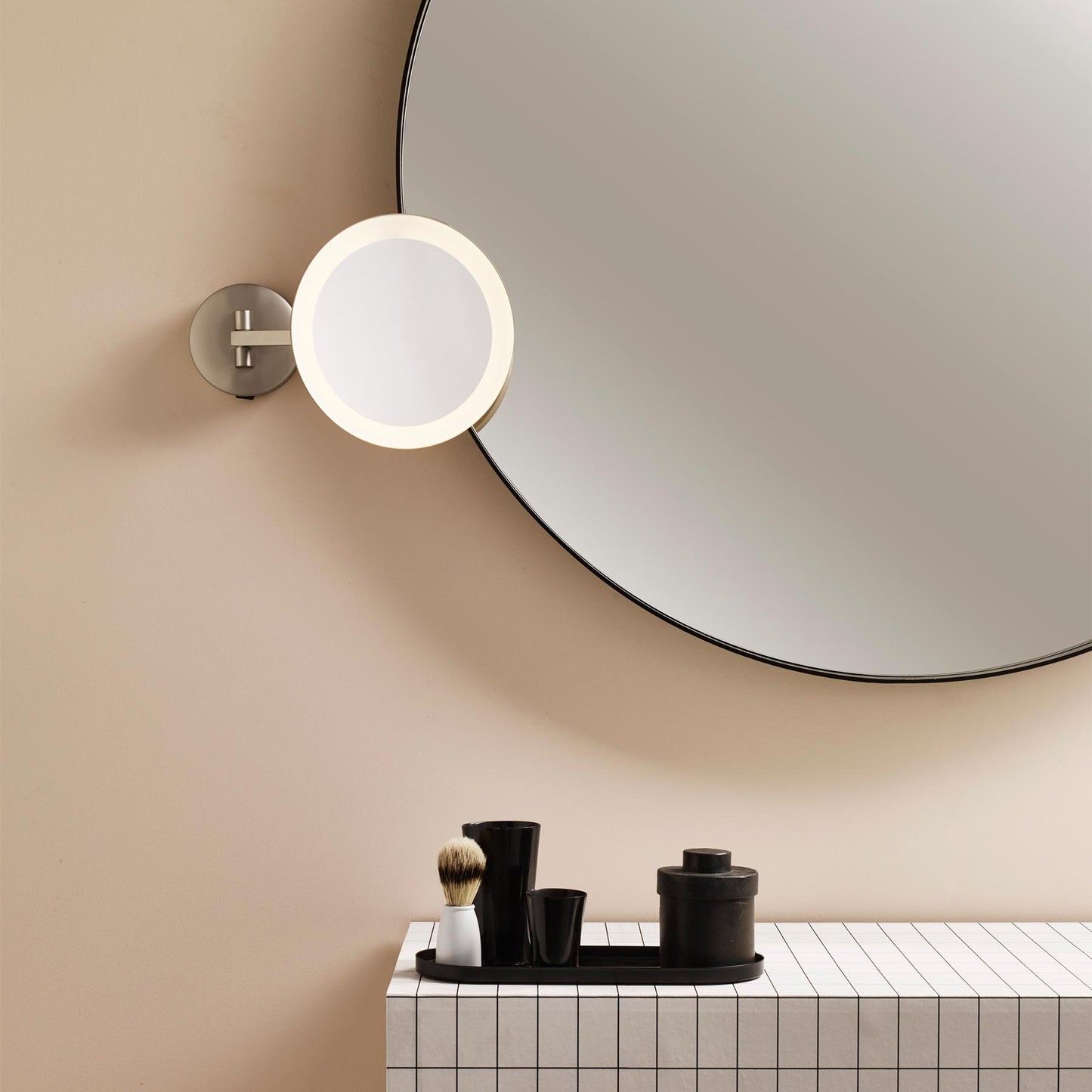 Mascali Round LED Magnifying Mirror in bathroom.