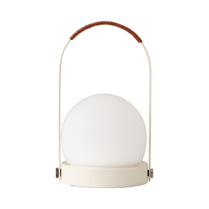 Carrie Outdoor LED Rechargeable Table Lamp in Ivory/Leather-wrapped.