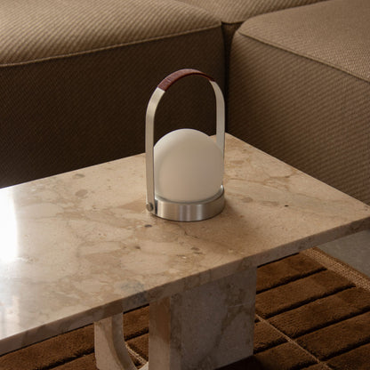 Carrie Outdoor LED Rechargeable Table Lamp in living room.