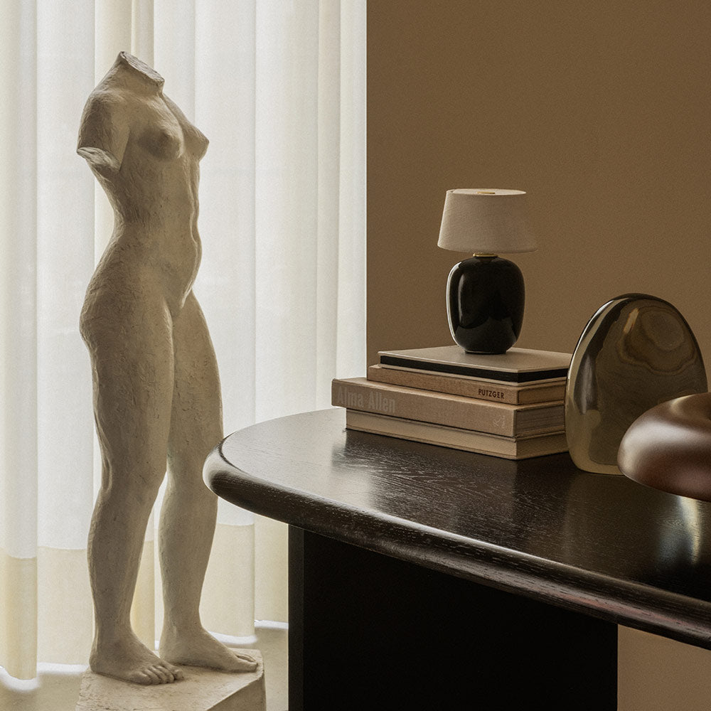 Torso LED Rechargeable Table Lamp in living room.
