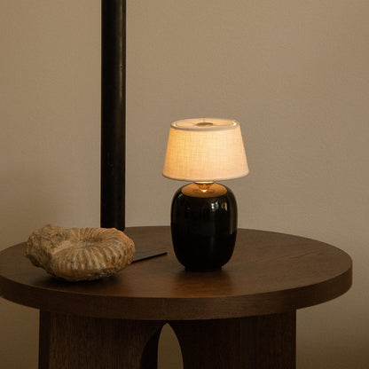 Torso LED Rechargeable Table Lamp in living room.