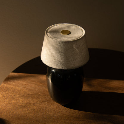 Torso LED Rechargeable Table Lamp in living room.