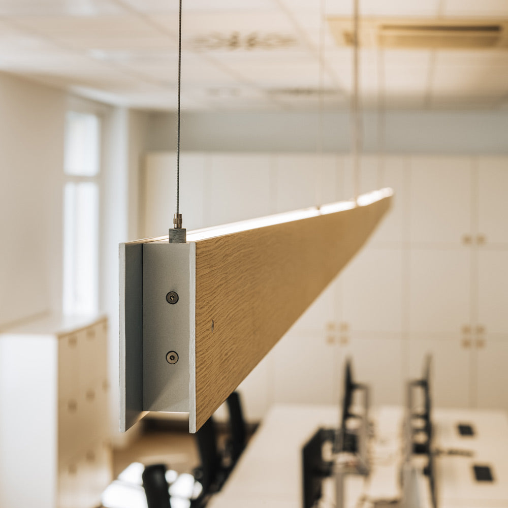 Marc Dos S LED Linear Pendant Light in office.