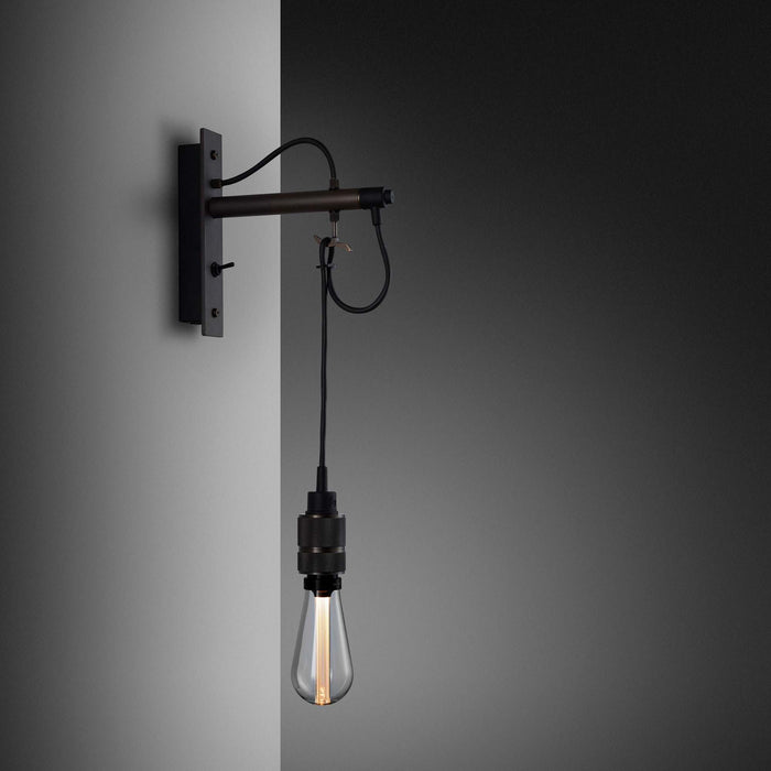 Hooked Nude Wall Light in Graphite/Smoked Bronze.