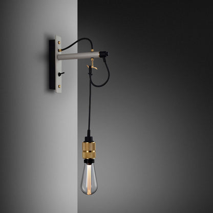 Hooked Nude Wall Light in Stone/Brass.