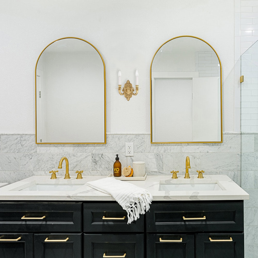 Cast Brass Ornate Wall Light in bathroom.