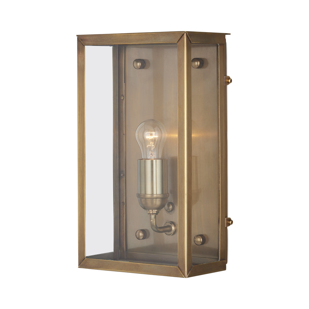 Royster Outdoor Wall Light in Antique Brass.