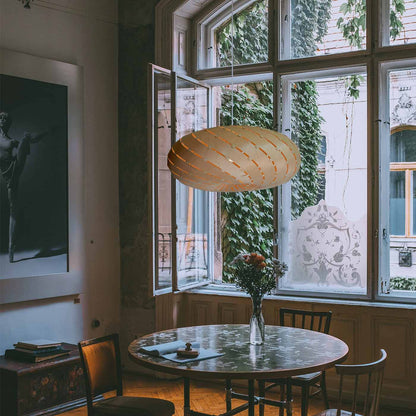 Ebb LED Swell Pendant Light in dining room.