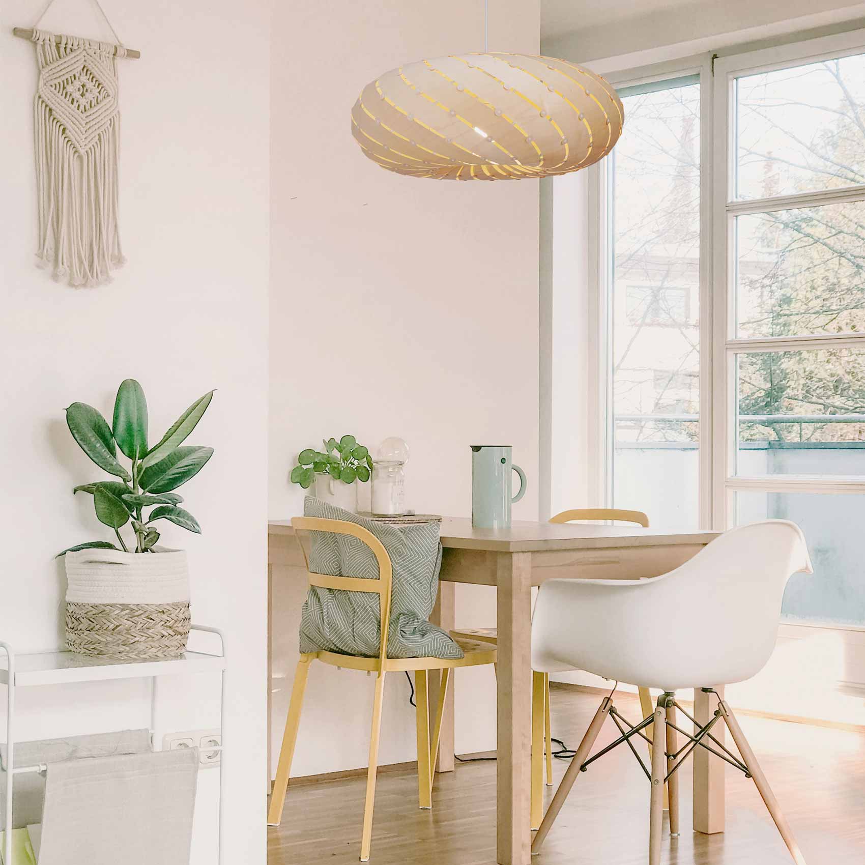 Ebb LED Swell Pendant Light in dining room.