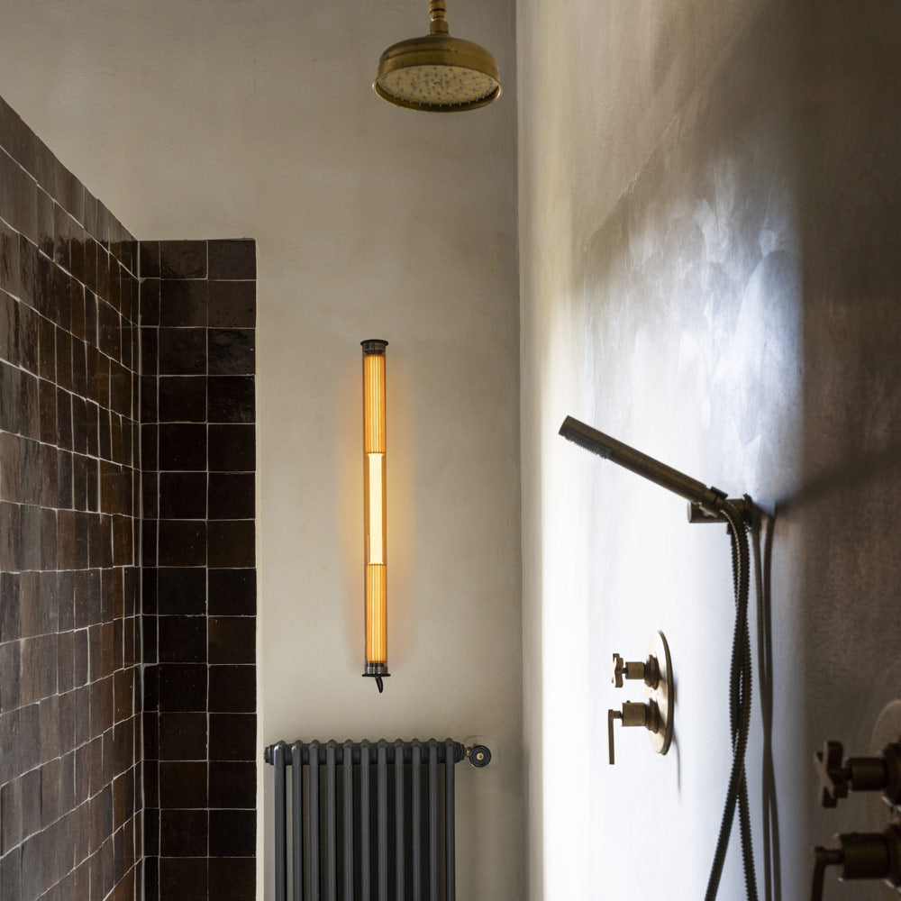 In The Tube 360° LED Wall Light in bathroom.