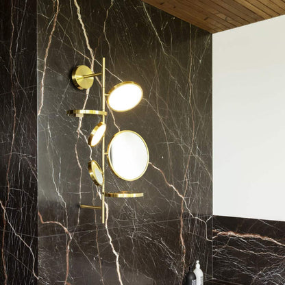 Tell Me Stories LED Wall Light in bathroom.