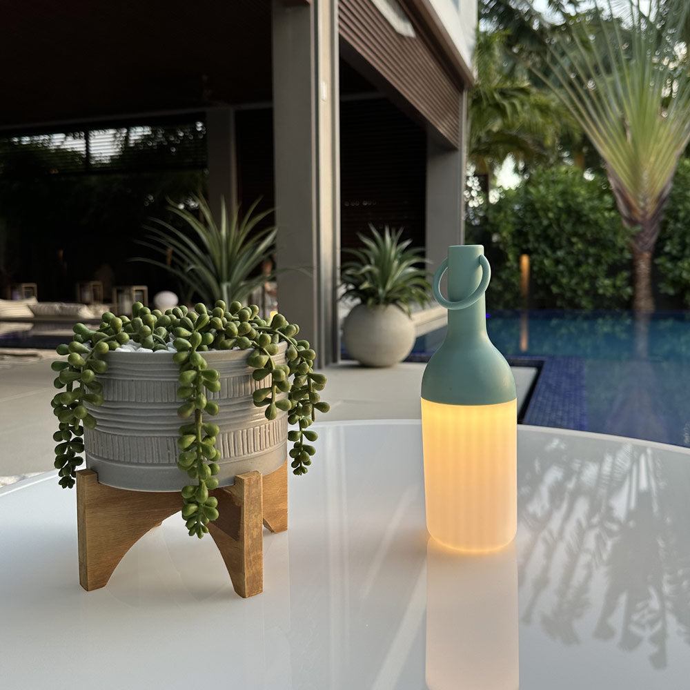 ELO Nomad Portable Outdoor LED Table Lamp in Outdoor area.