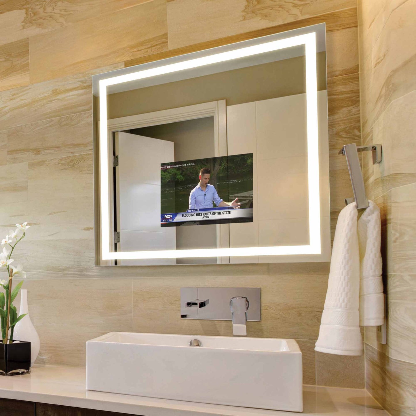 Integrity LED Lighted Mirror TV in bathroom.