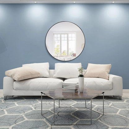 Elegant Round Framed Mirror in living room.