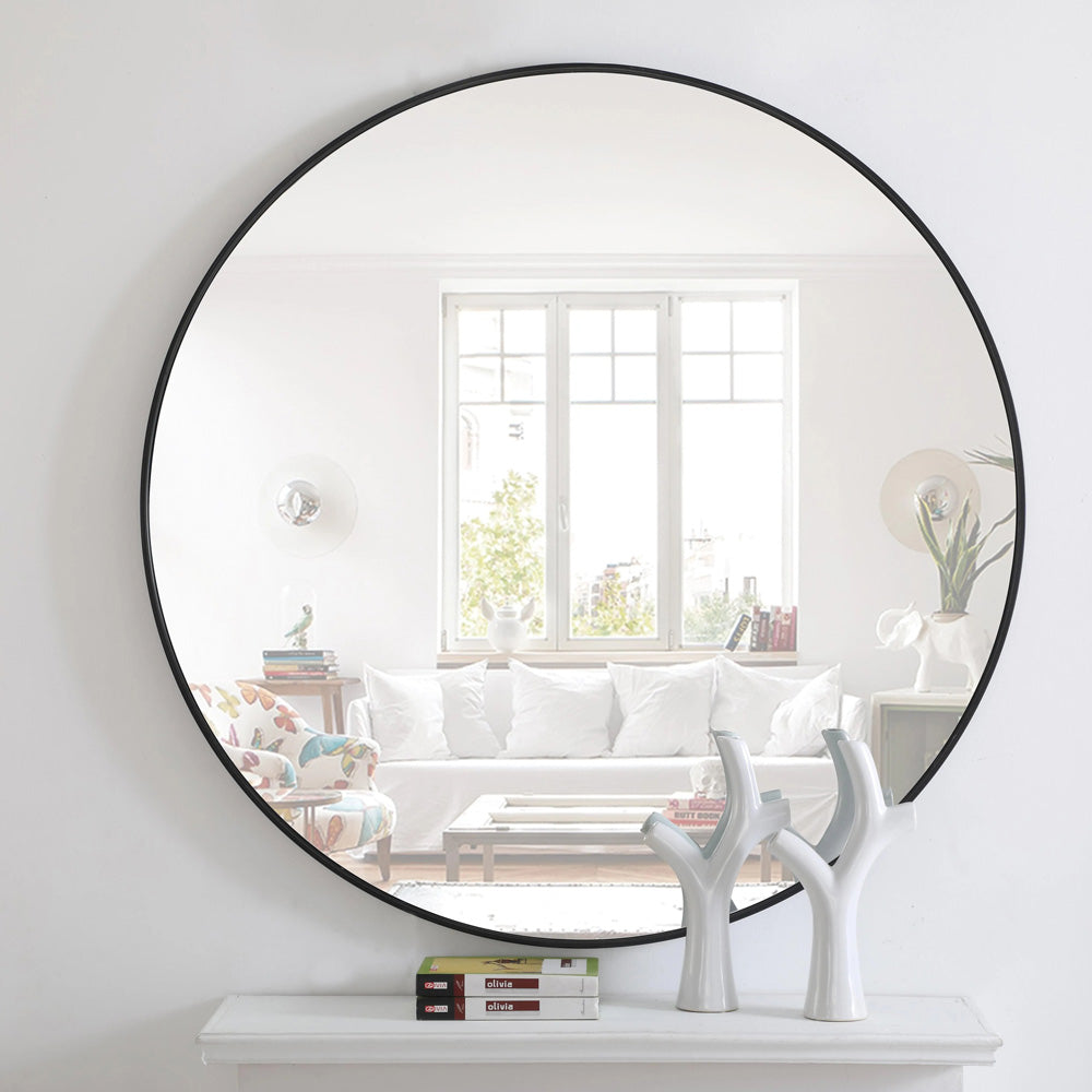 Elegant Round Framed Mirror in living room.