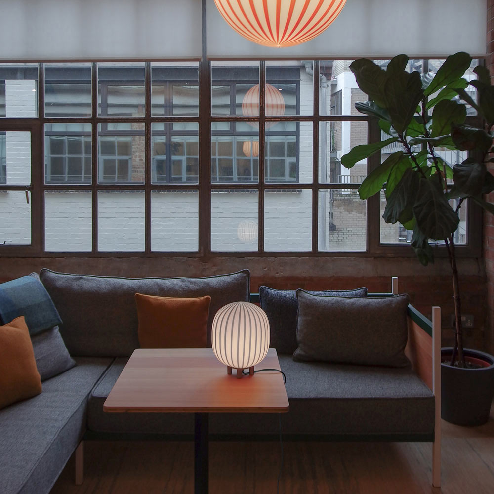 Filigrana Cylinder LED Table Lamp in living room.