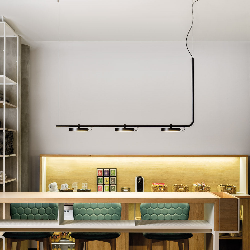 Aro Linear LED Pendant Light in living room.