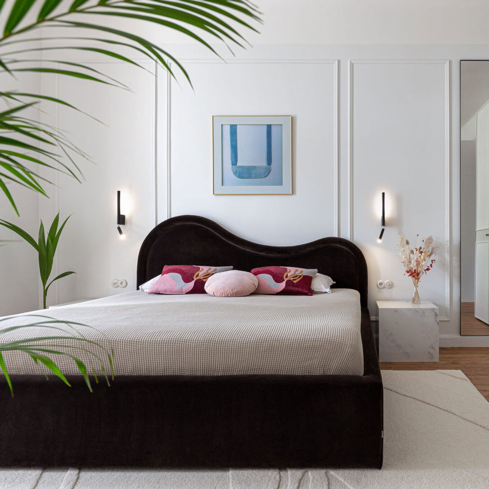Canut LED Wall Light in bedroom.