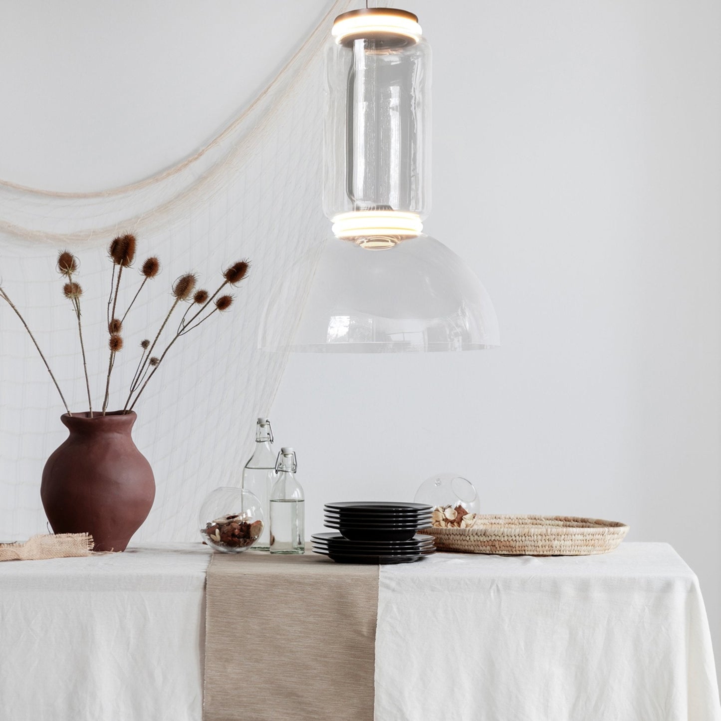 Noctambule Low Cylinder and Bowl LED Pendant Light in dining room.