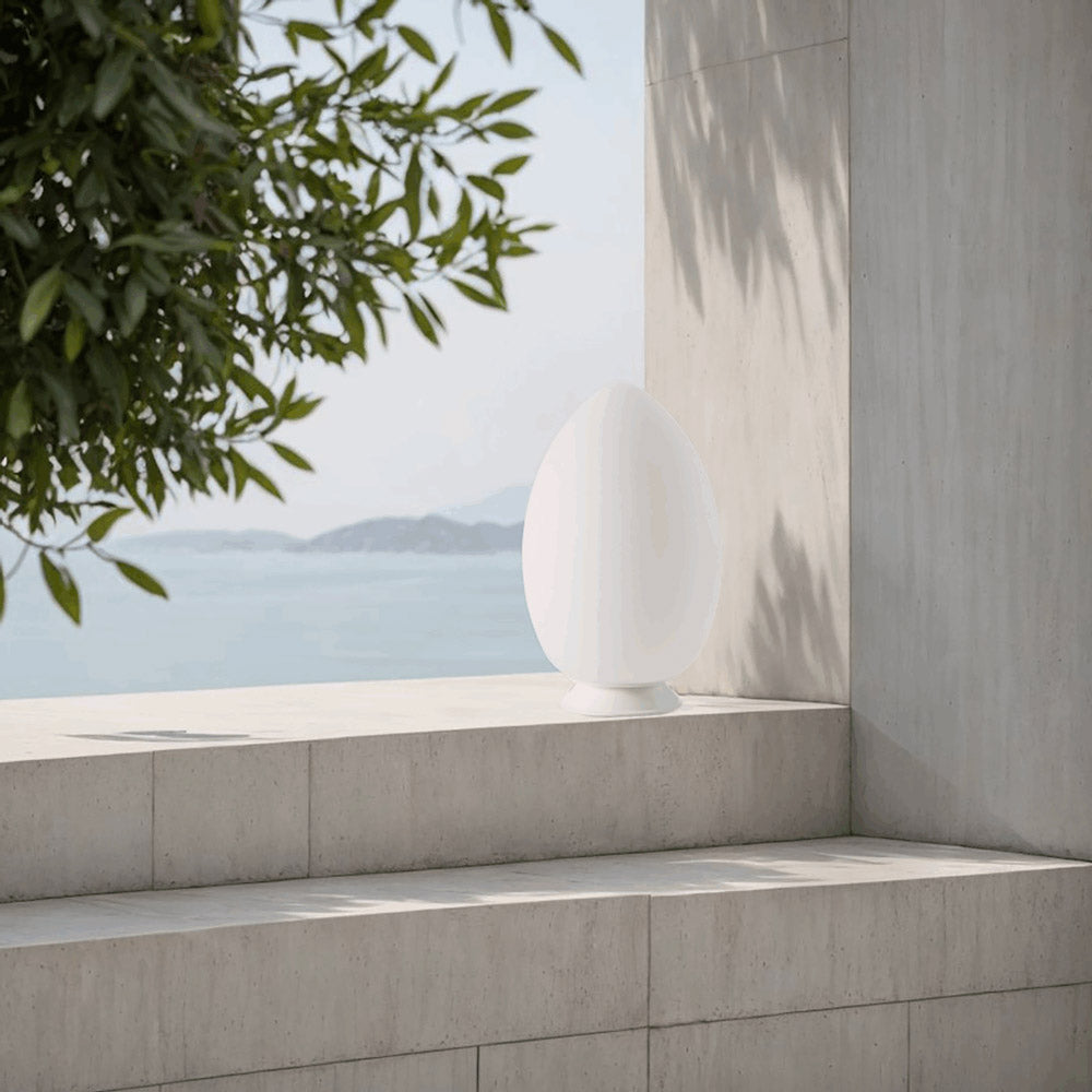 Uovo LED Rechargeable Table Lamp in Outside Area.