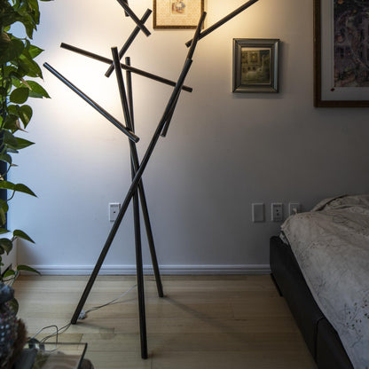 Tuareg LED Floor Lamp in bedroom.