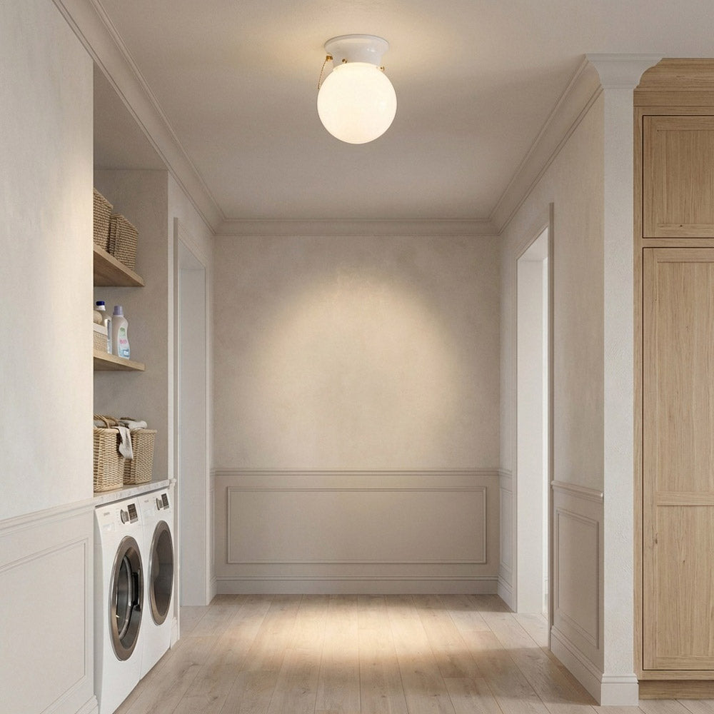Tomkin Flush Mount Ceiling Light in laundry room.