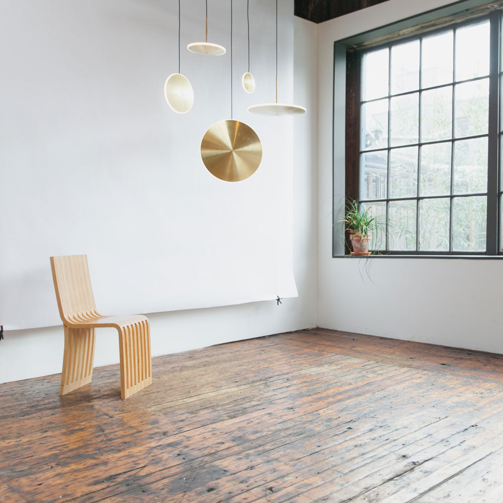 Chrona LED Vertical Pendant Light in living room.
