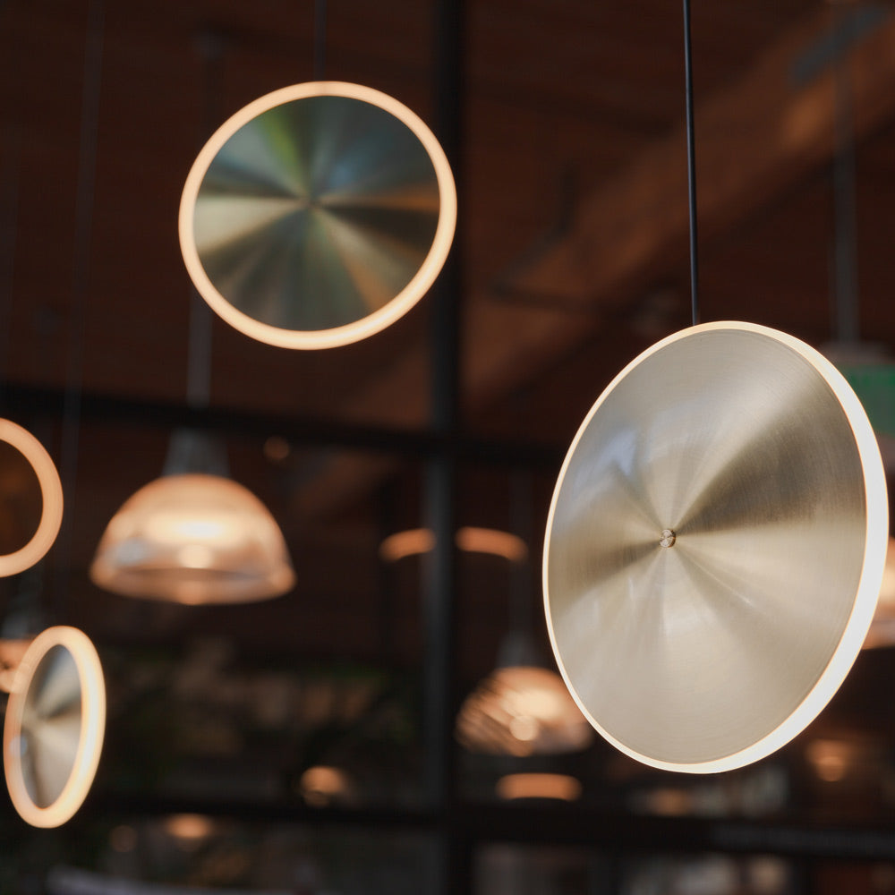 Chrona LED Vertical Pendant Light in room.