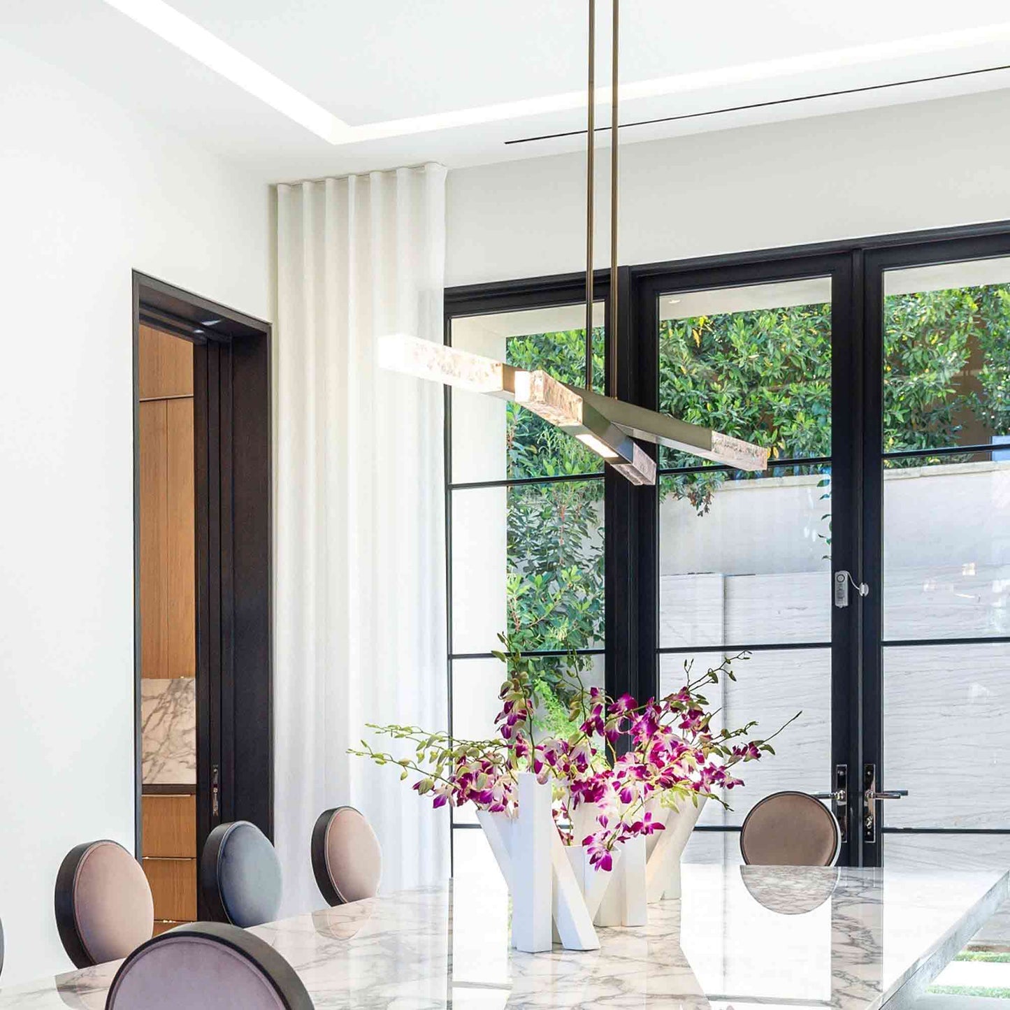 Axis LED Linear Pendant Light in dining room.