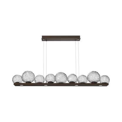 Gaia Linear LED Chandelier in Flat Bronze/Clear Blown Glass (59-Inch).
