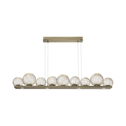 Gaia Linear LED Chandelier in Heritage Brass/Amber Blown Glass (59-Inch).