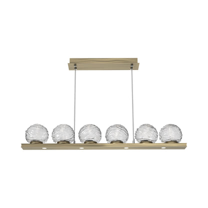 Gaia Linear LED Chandelier in Heritage Brass/Clear Blown Glass (44-Inch).