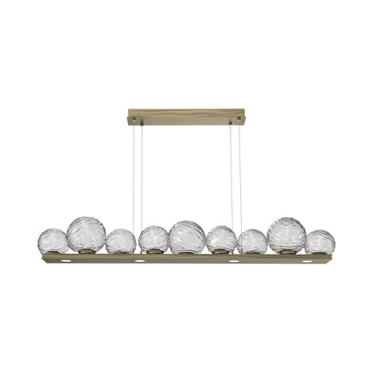 Gaia Linear LED Chandelier in Heritage Brass/Clear Blown Glass (59-Inch).