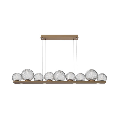 Gaia Linear LED Chandelier in Novel Brass/Clear Blown Glass (59-Inch).