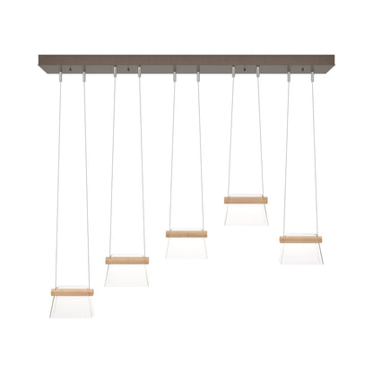 Cowbell LED Linear Pendant Light in Bronze/Clear Glass.