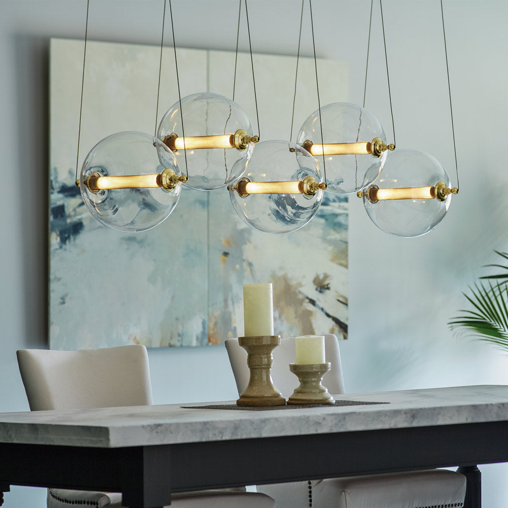 Otto Sphere Linear Pendant Light in living room.