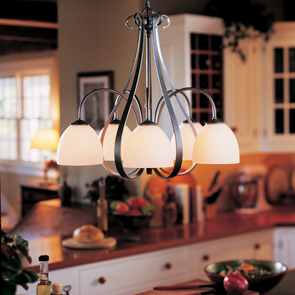 Sweeping Taper Chandelier in kitchen.
