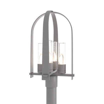 Triomphe Outdoor Post Light in Coastal Burnished Steel/Seeded Clear Glass.