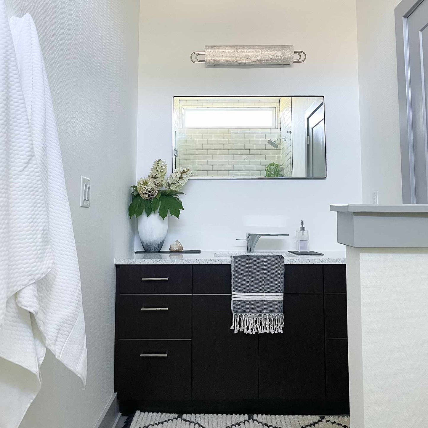 Buckley Bath Vanity Light in bathroom.