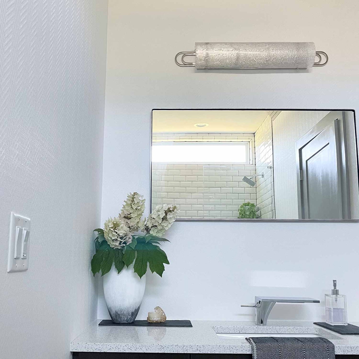 Buckley Bath Vanity Light in bathroom.
