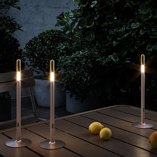 Glim Outdoor LED Portable Table Lamp in Outside Area.