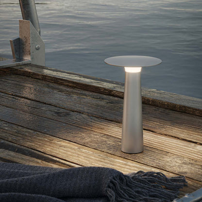 Lix Outdoor LED Portable Table Lamp in Outside Area.